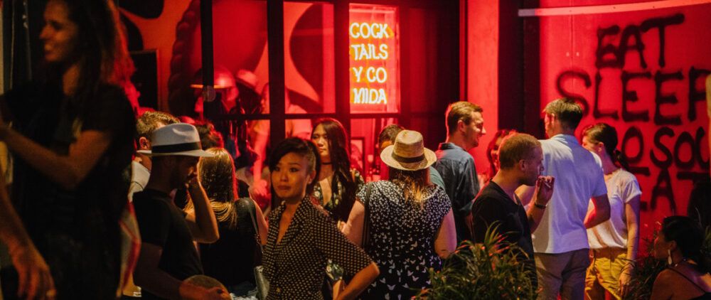 A group of people networking in the restaurant.