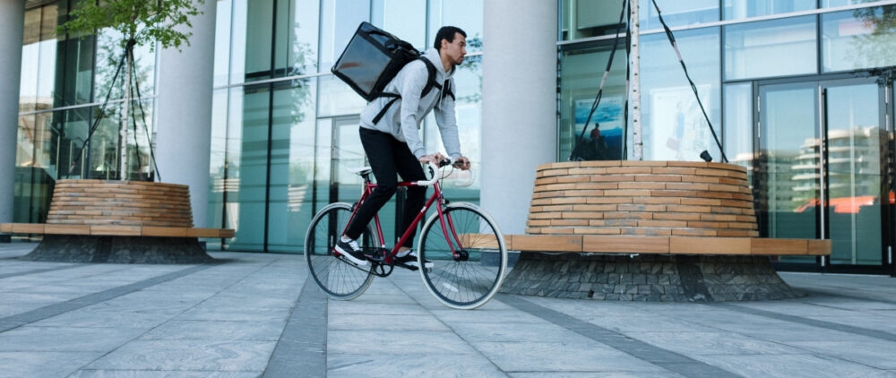 A delivery guy with a bicycle.