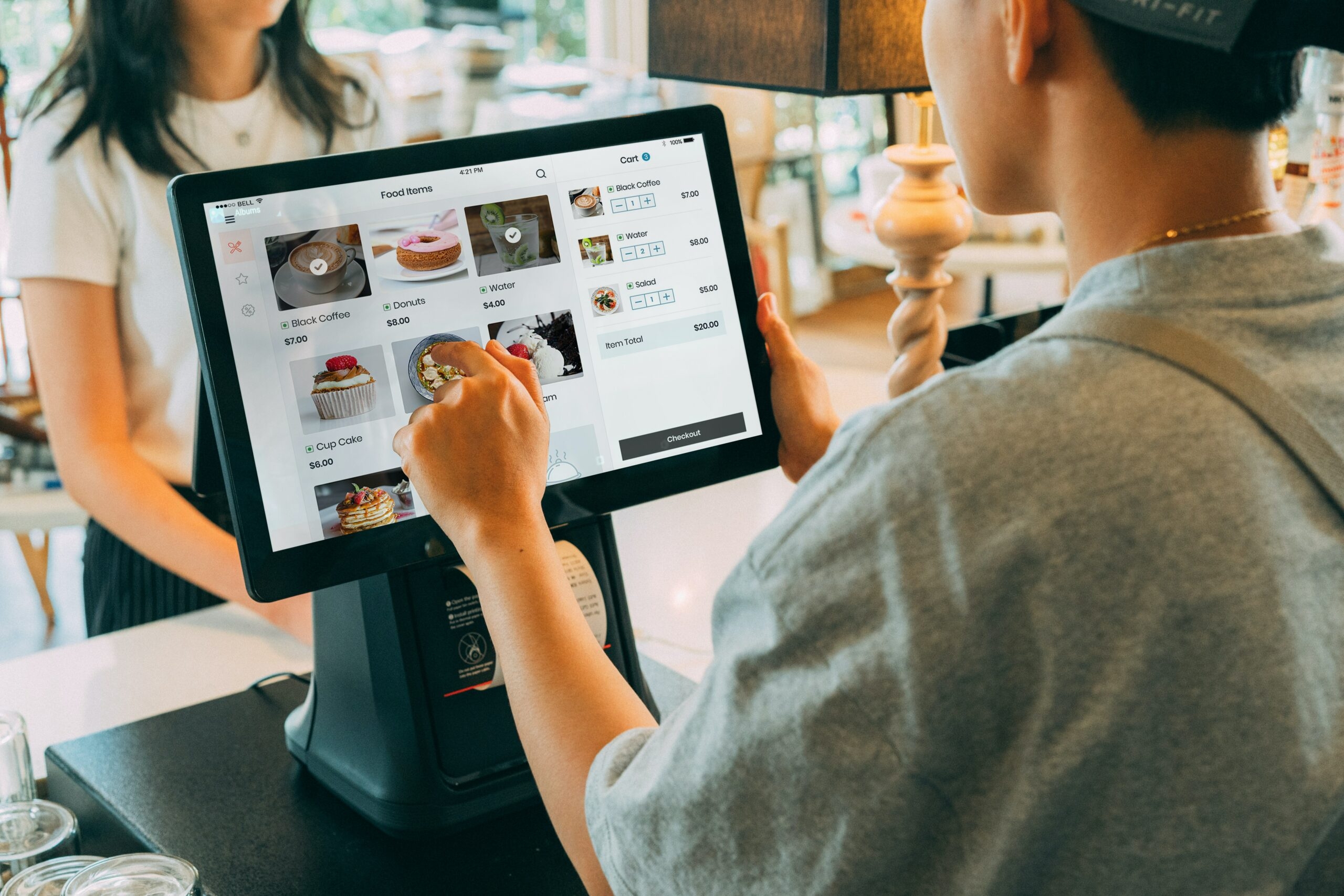 A waiter is taking an order from a customer.