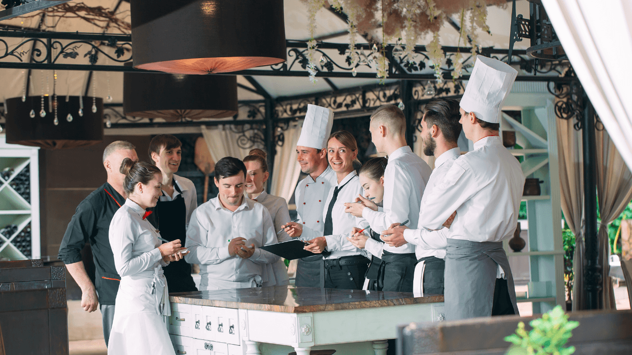 Group of cooks are having a discussion.